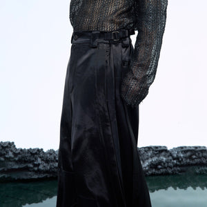 Fashionable wide-leg pants styled with urban streetwear look showing the avant-garde design