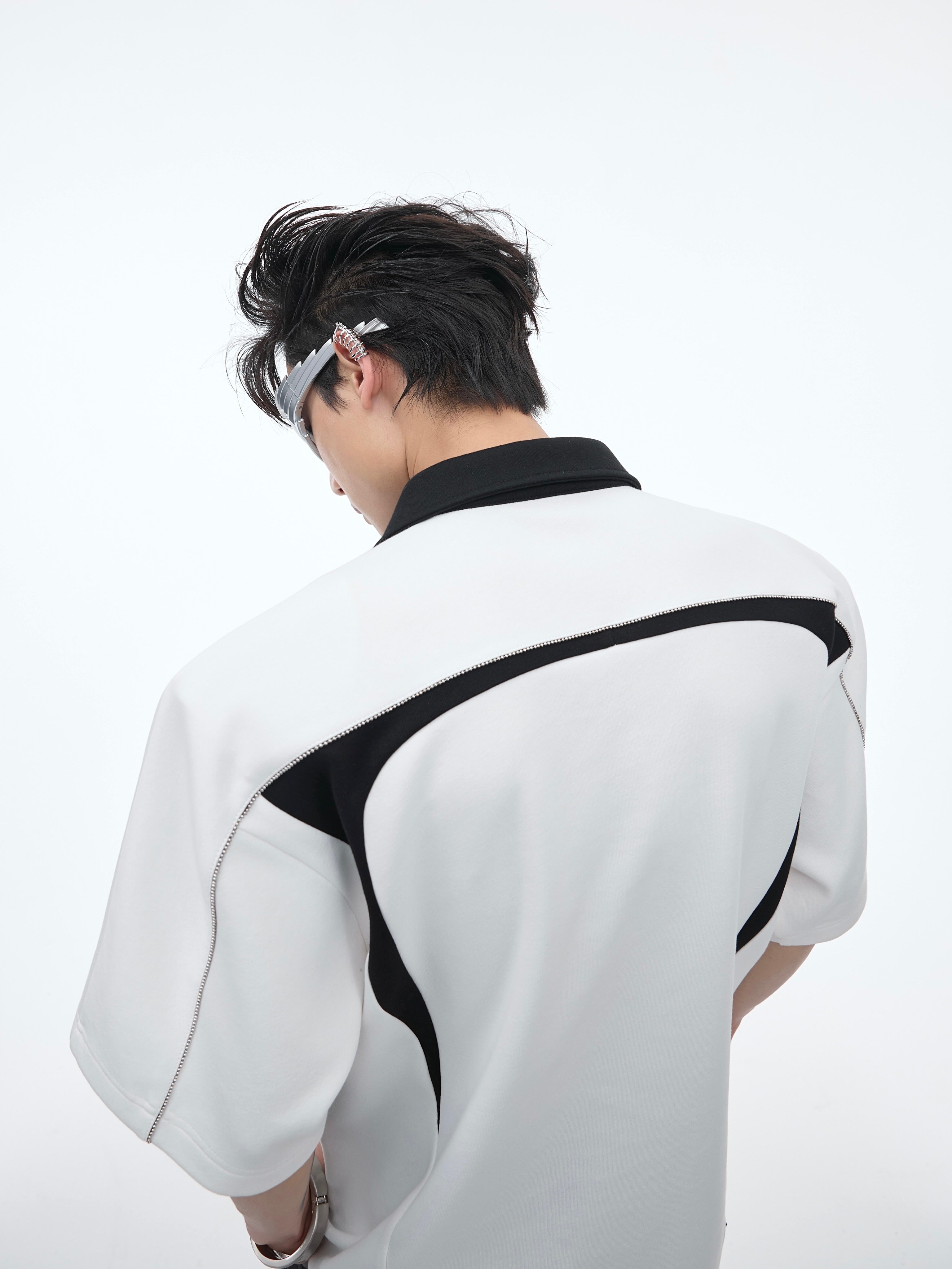 Back view of breathable yet wind-resistant oversized polo tee with urban streetwear style