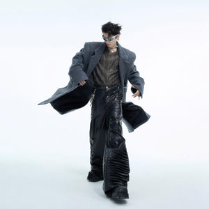 Back view of loose belted trench coat showing premium wool fabric texture and relaxed fit