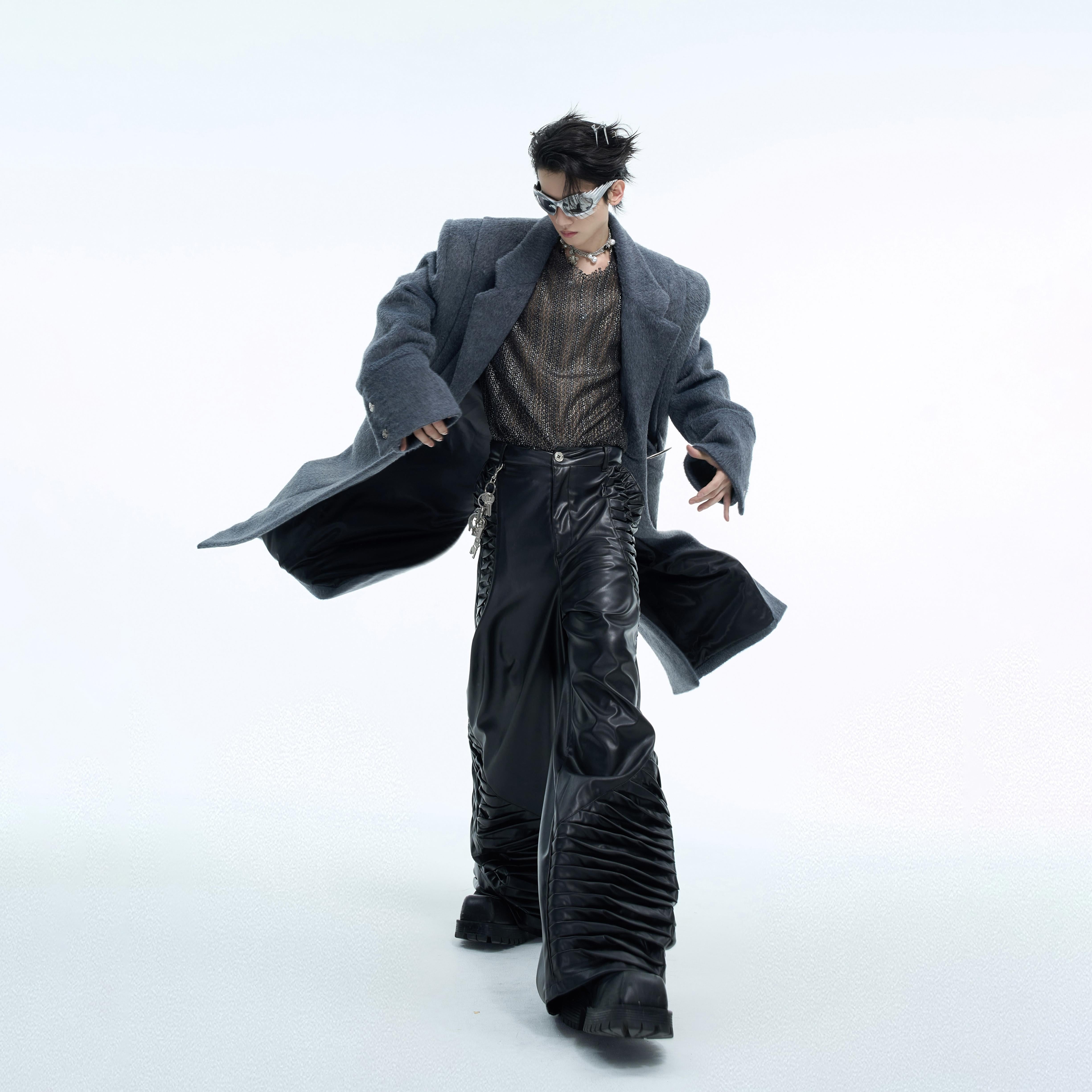 Back view of loose belted trench coat showing premium wool fabric texture and relaxed fit