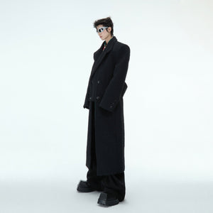 Close-up of the cinched waist detail on this oversized wool coat, highlighting the tailored yet edgy streetwear aesthetic