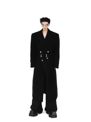 Deconstructed wool coat with prominent metal airplane buckle closure and shoulder pads, avant-garde streetwear fashion