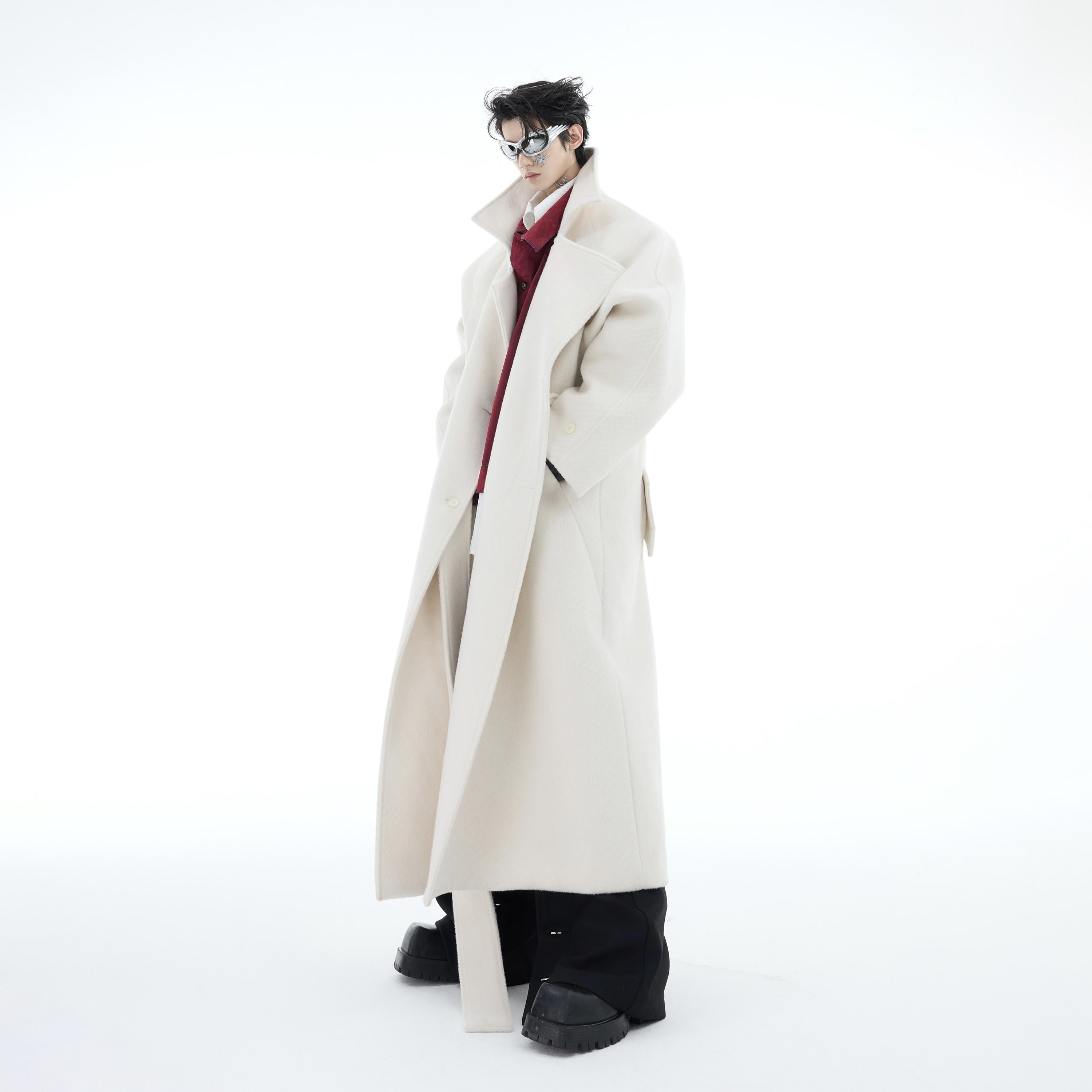 Close-up of heavyweight wool coat showing premium stitching and fabric density details
