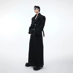 Close-up of the metal buckle detailing on premium wool long trench coat with stand collar