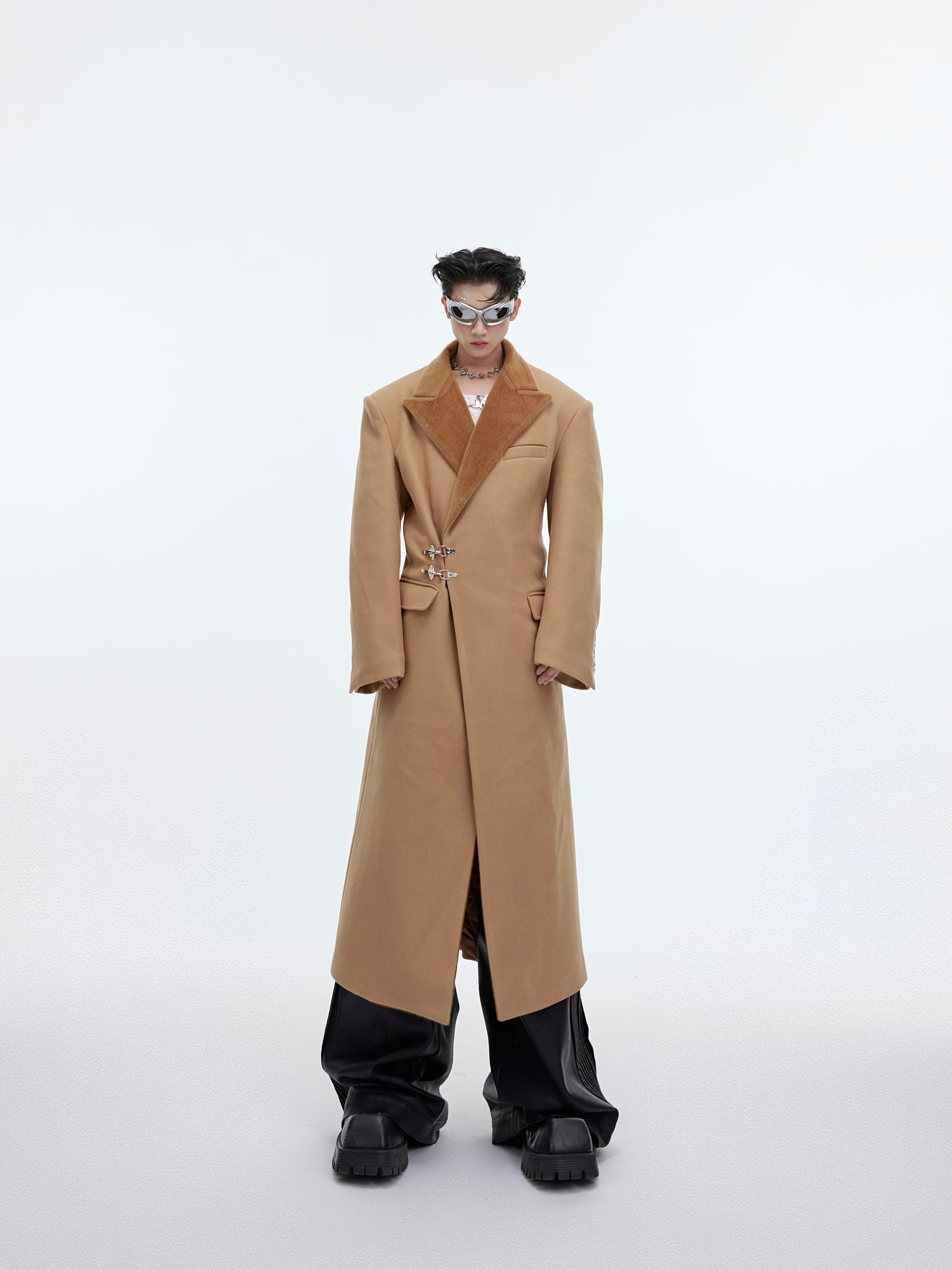 Close-up detail showing the premium mixed fabric textures of this stylish deconstructed trench coat
