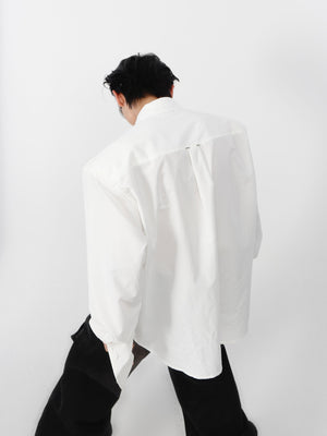 Close-up of unique wrinkle design and open front on this avant-garde cotton shirt for men