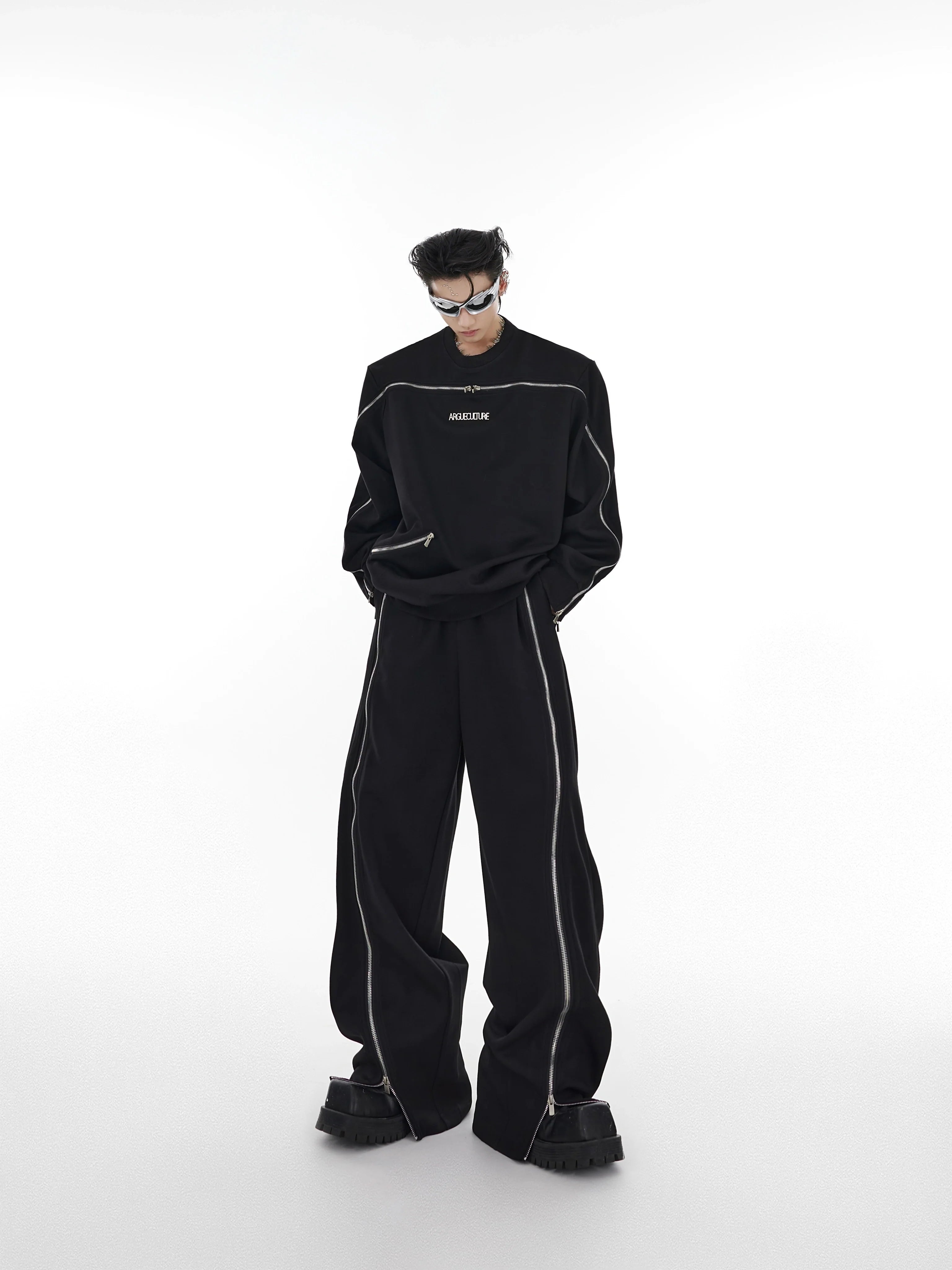 Deconstructed zip-up hoodie with premium metal zippers in oversized streetwear style