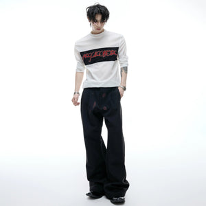 Model wearing mesh long sleeve tee with baggy cargo pants