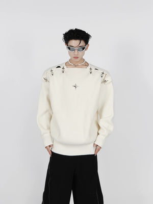 Front view of black metal buckle cutout knit sweater on a model