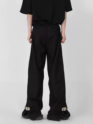 Back view showing the relaxed straight fit of the black trousers
