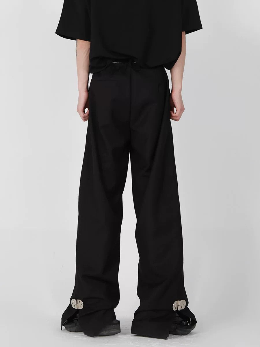 Back view showing the relaxed straight fit of the black trousers