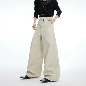 Model wearing apricot croc-textured pants in an urban setting