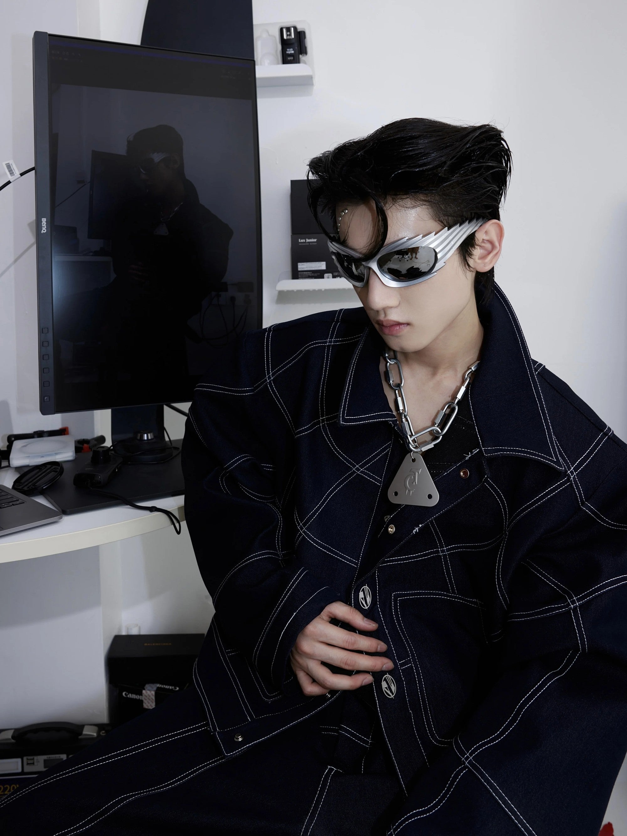 Close up of the matte heavy industrial lock and triangle logo pendant