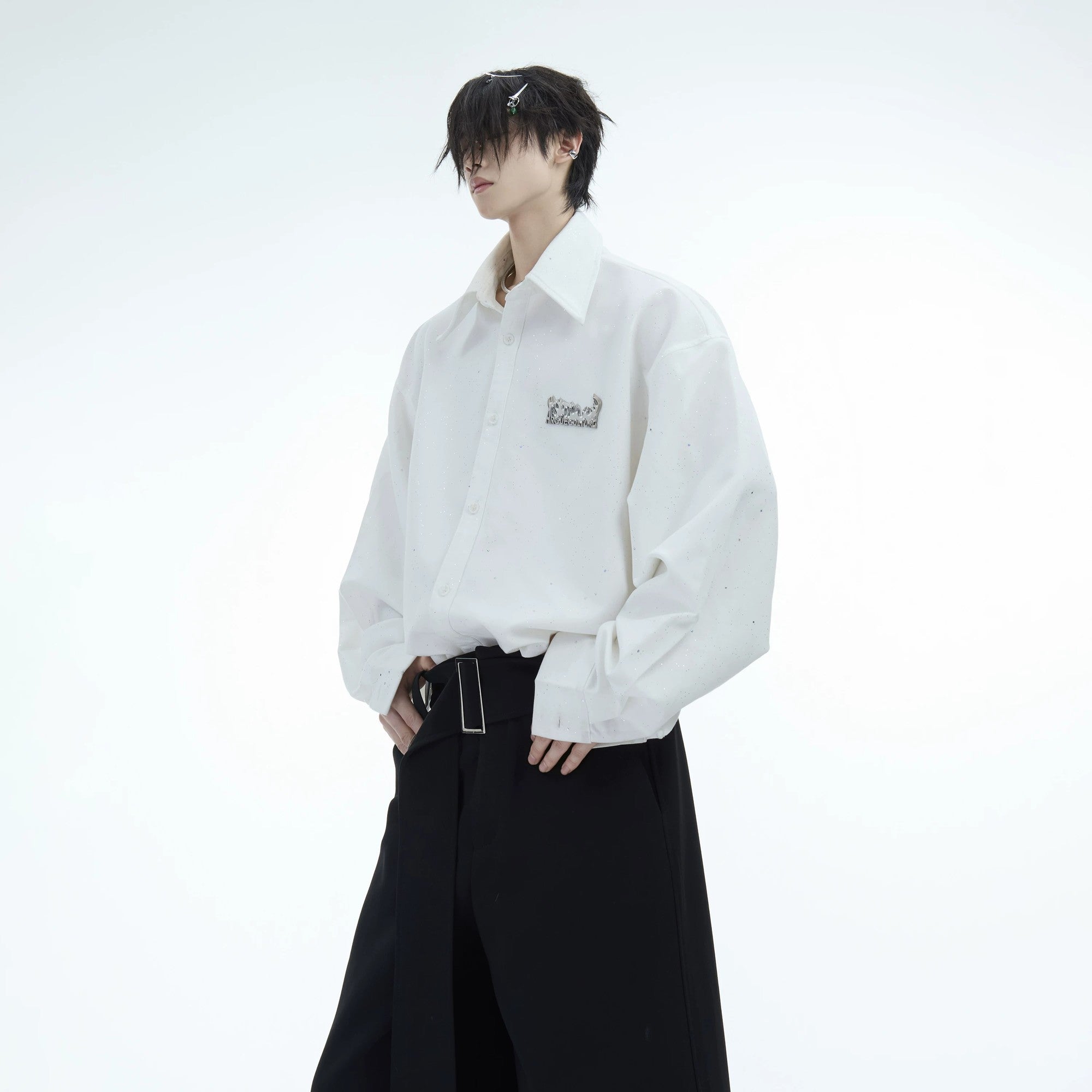 Male model wearing oversized shimmer flame shirt in urban setting