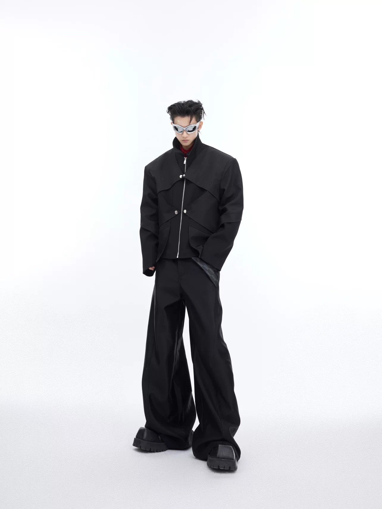 A futuristic streetwear look featuring a high-shine liquid metal jacket