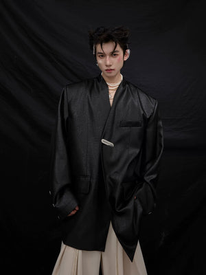 Close-up detail of the metallic liquid texture on the blazer fabric