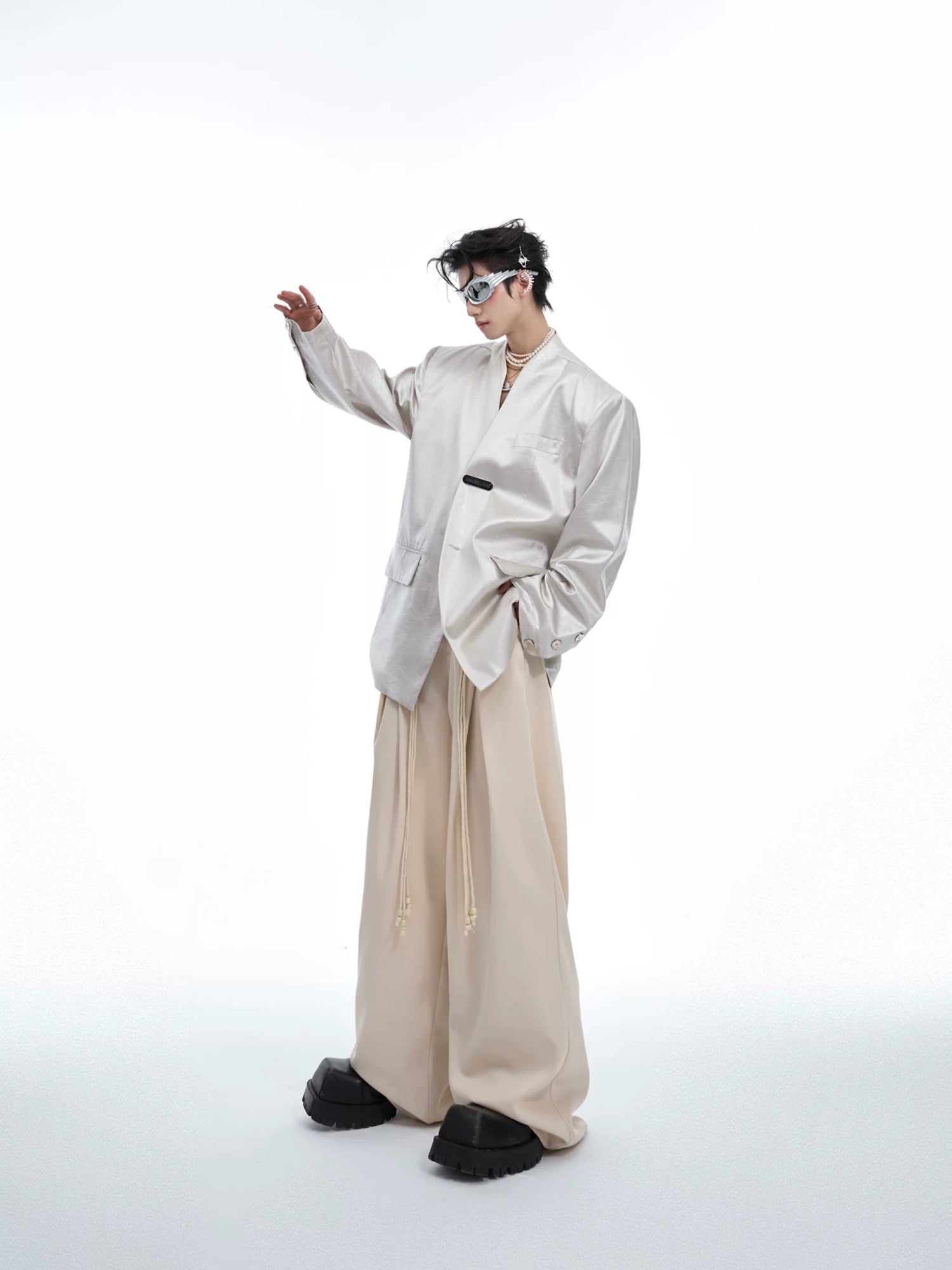 Full body shot of the silver avant-garde blazer styled for streetwear