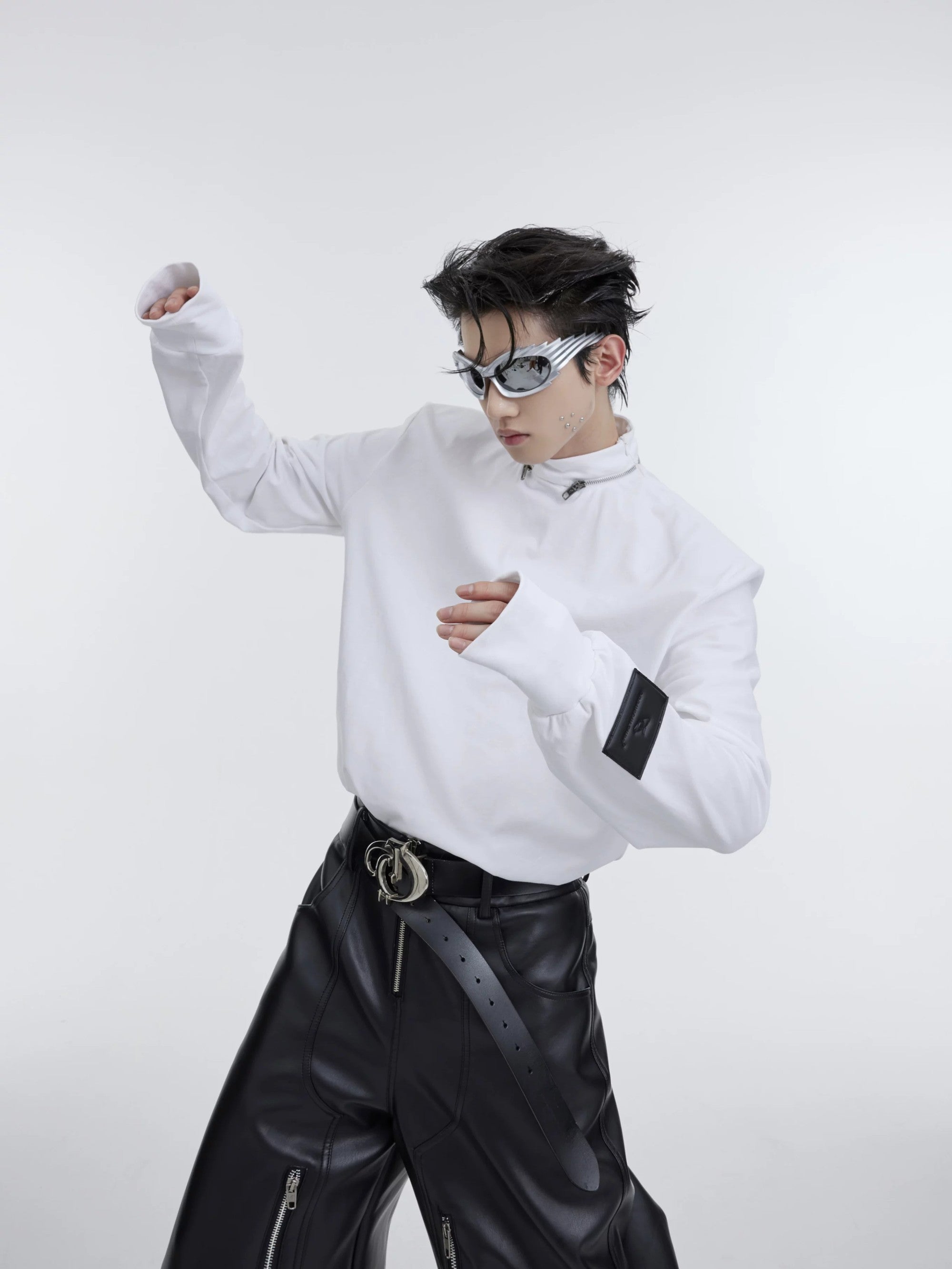 Close up of metal strap zipper detail on mock neck collar