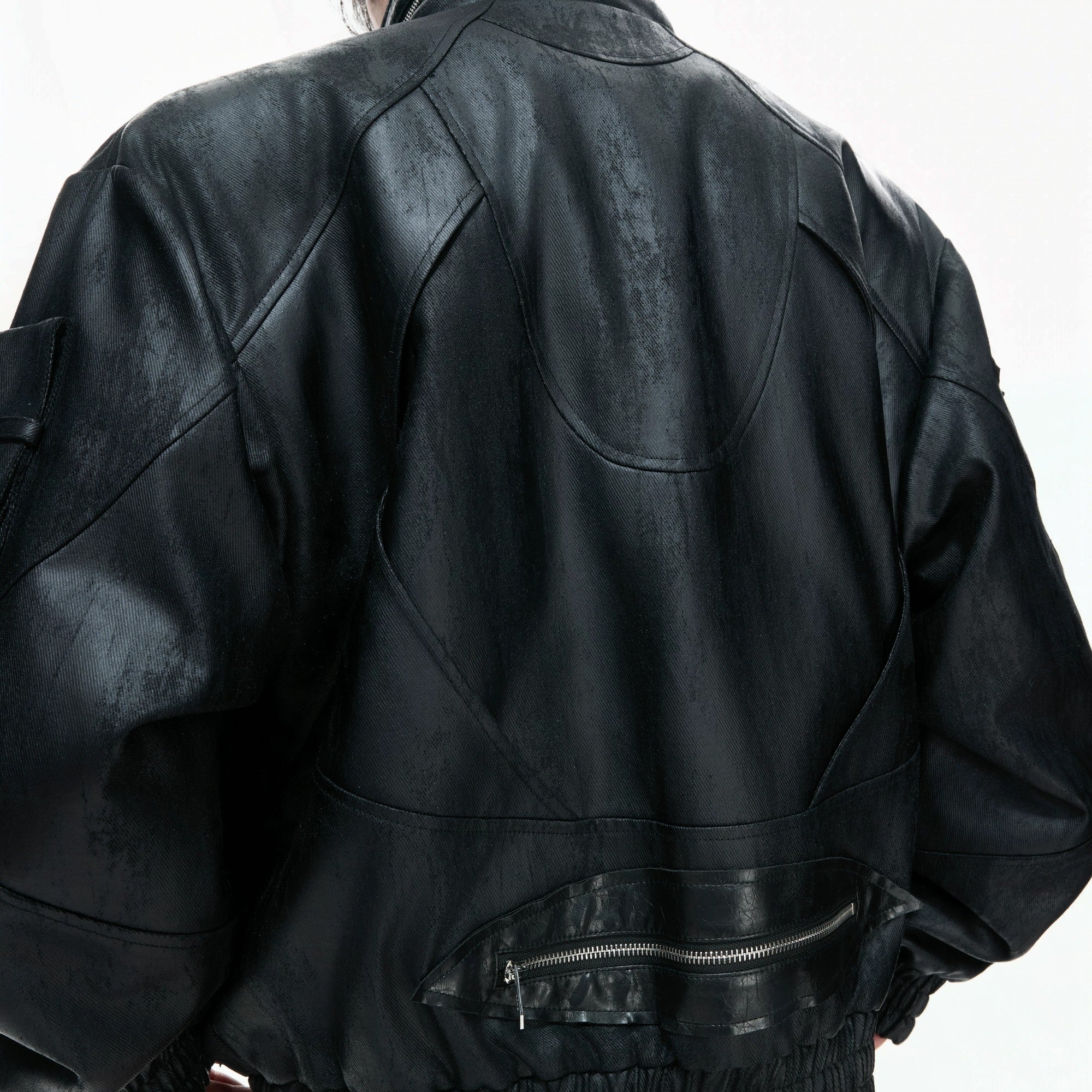 Back view of the heavyweight deconstructed moto jacket showing its loose fit