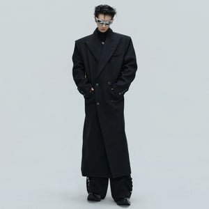 Front view of oversized black alpaca wool trench coat with double-breasted design