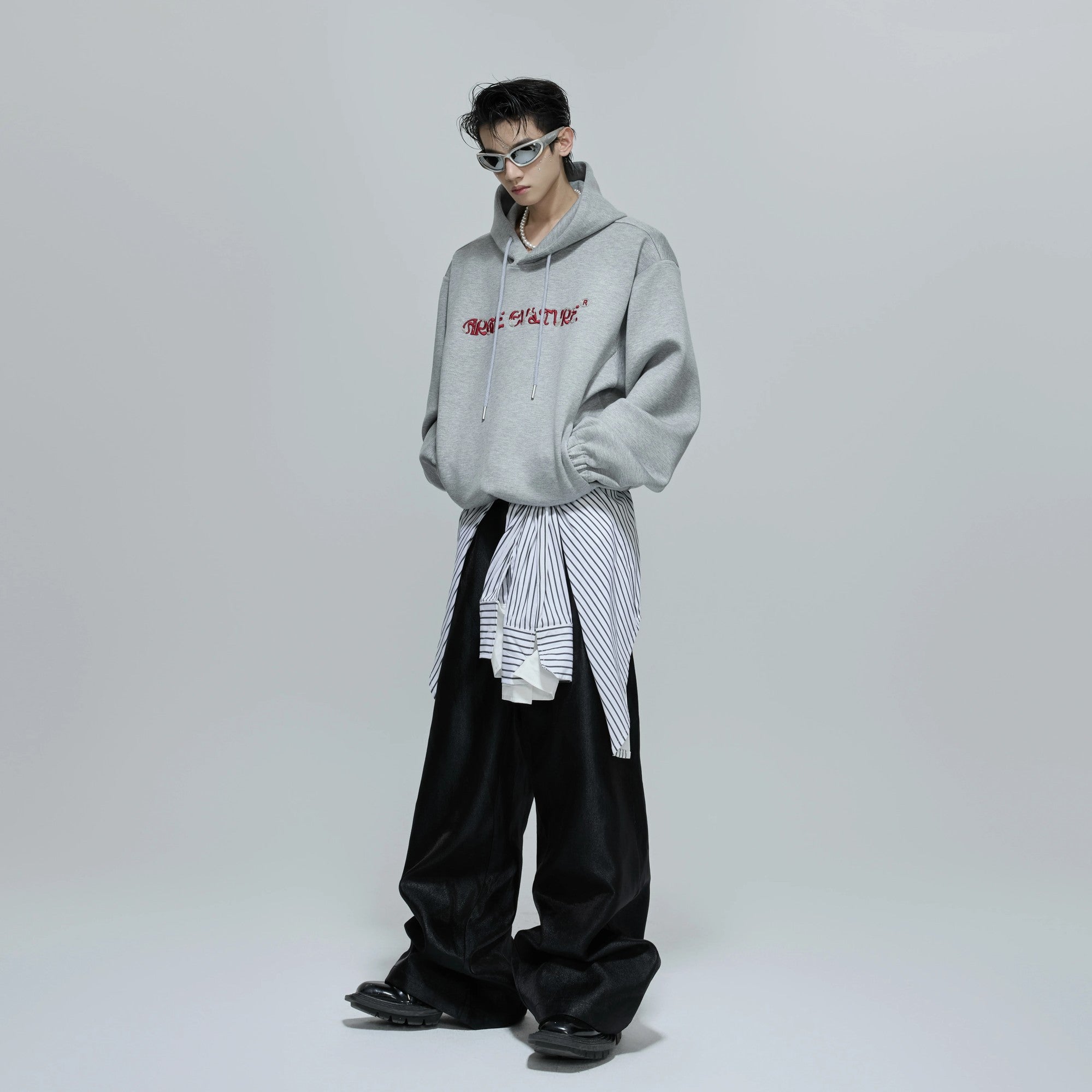 Collection of oversized beaded hoodies in gray, white, red, and black