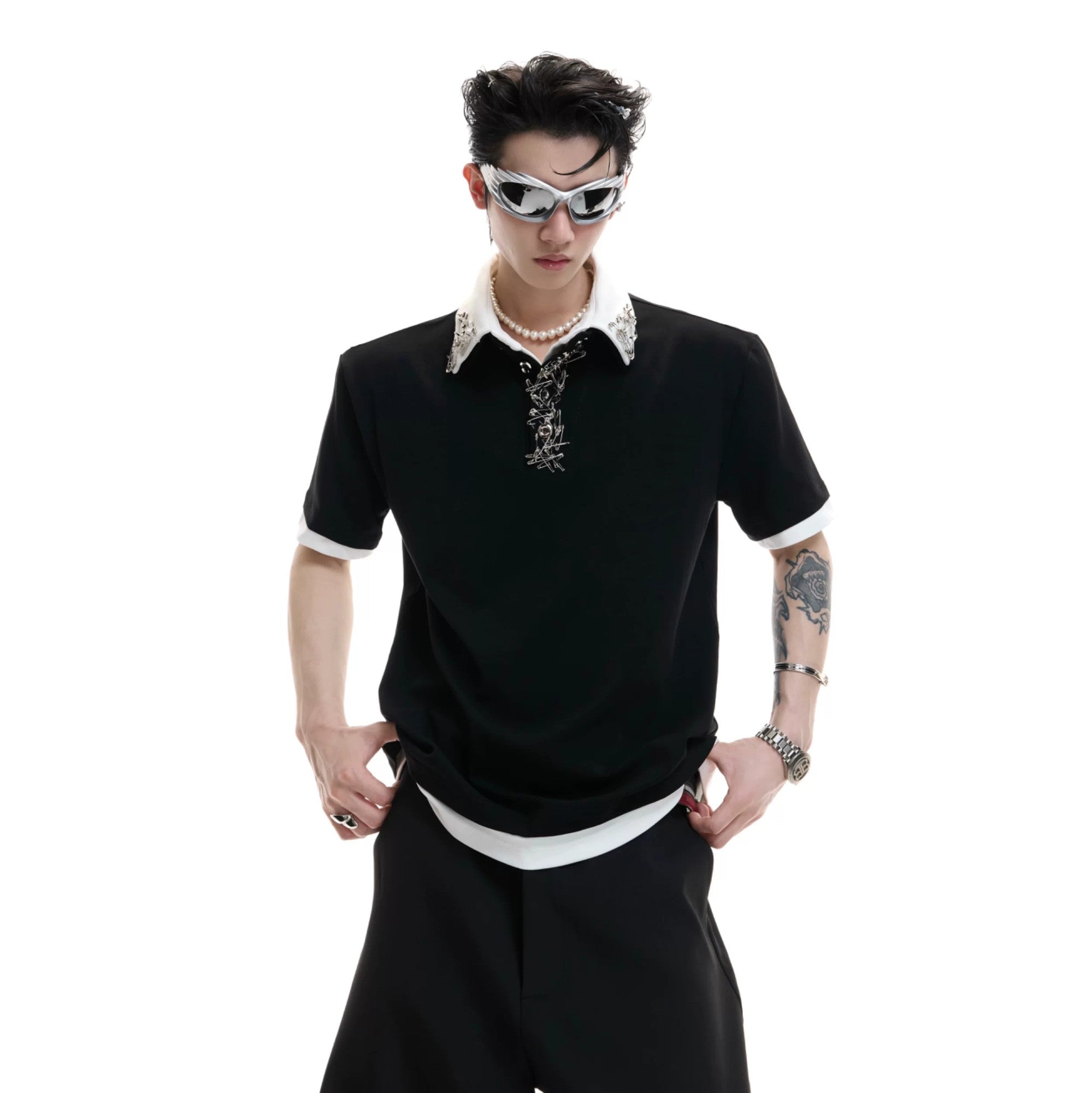 Close-up of the avant-garde metal pin and buckle on the shirt collar.