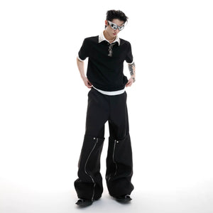 Male model wearing oversized deconstructed t-shirt in an urban setting.