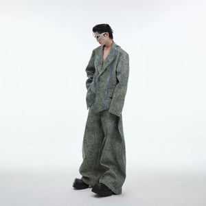 Lifestyle shot of the green deconstructed denim blazer in an urban setting