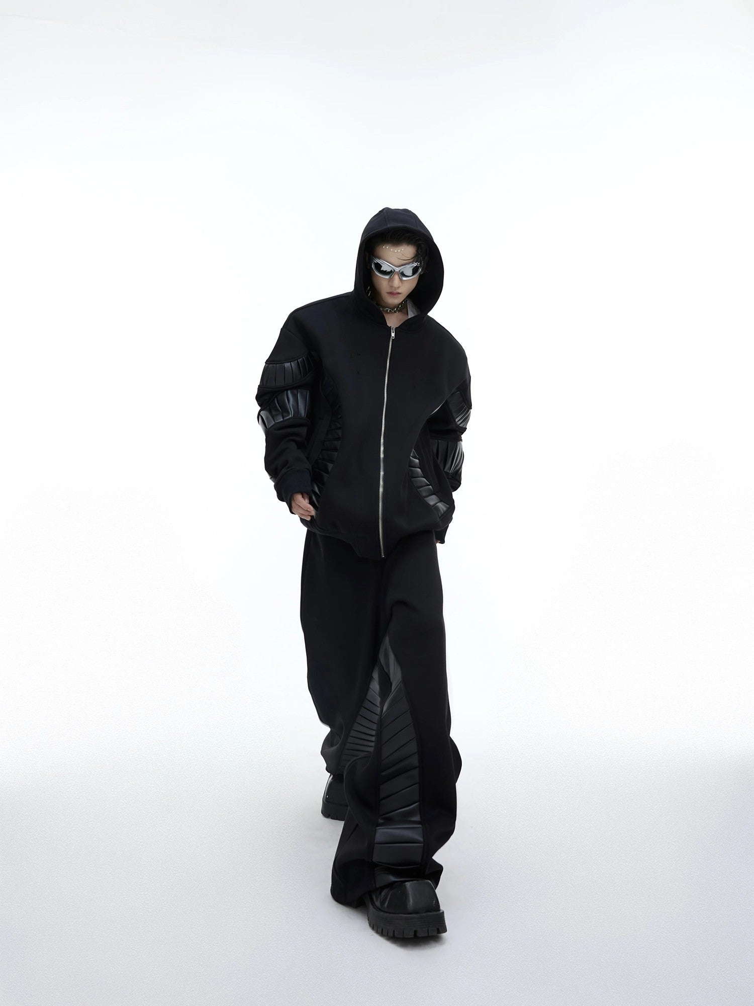 Back view of oversized deconstructed tracksuit on model