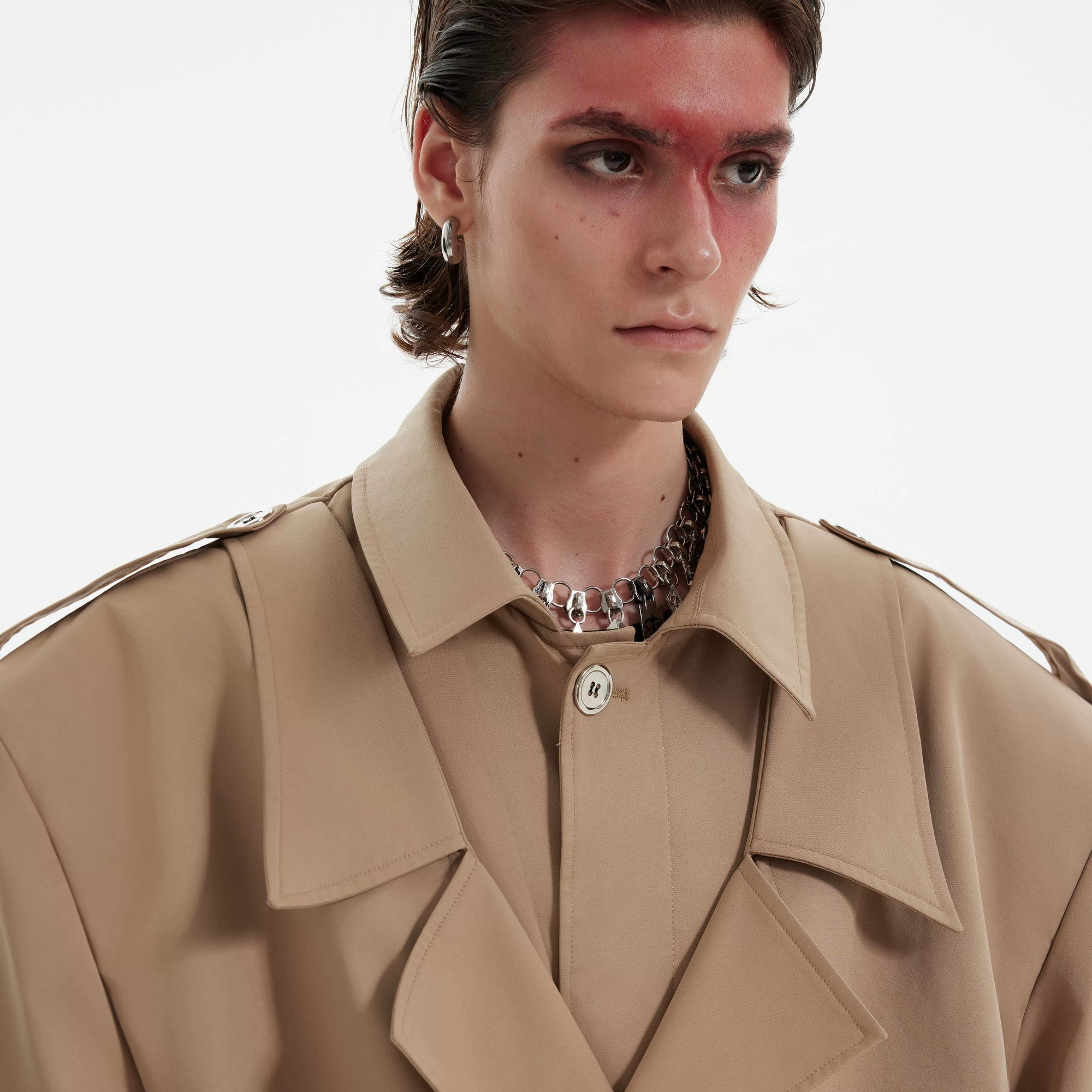 Back view showing the stylish vent and oversized silhouette of the trench coat.