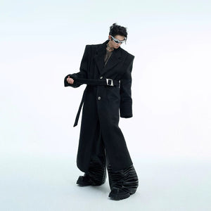 Fashionable man wearing a deconstructed wool coat in an urban setting