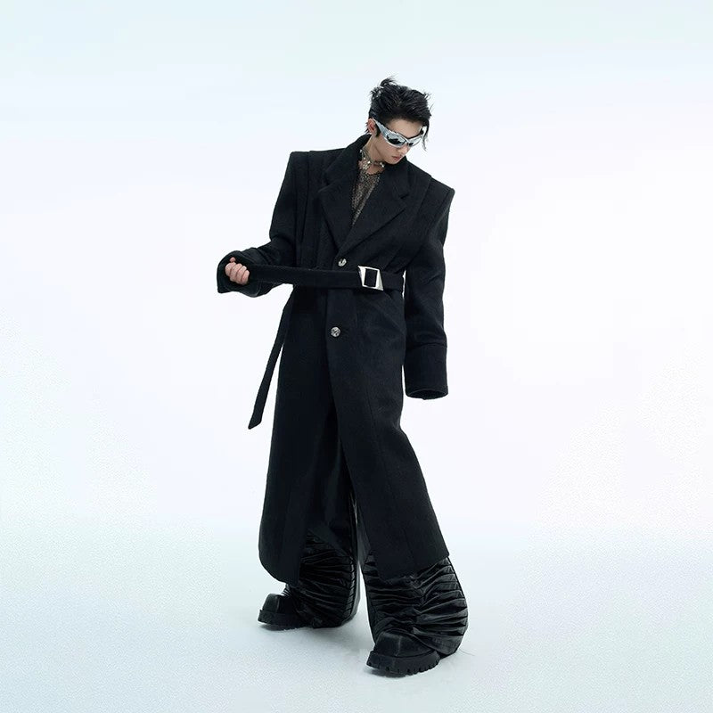 Fashionable man wearing a deconstructed wool coat in an urban setting