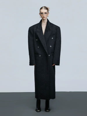 Oversized double-breasted alpaca wool coat in black with heavy shoulder pads