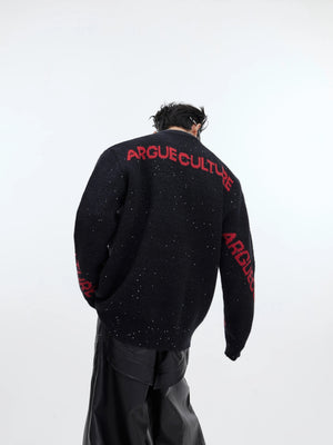 Front view of oversized black dragon graphic shimmer knit sweater
