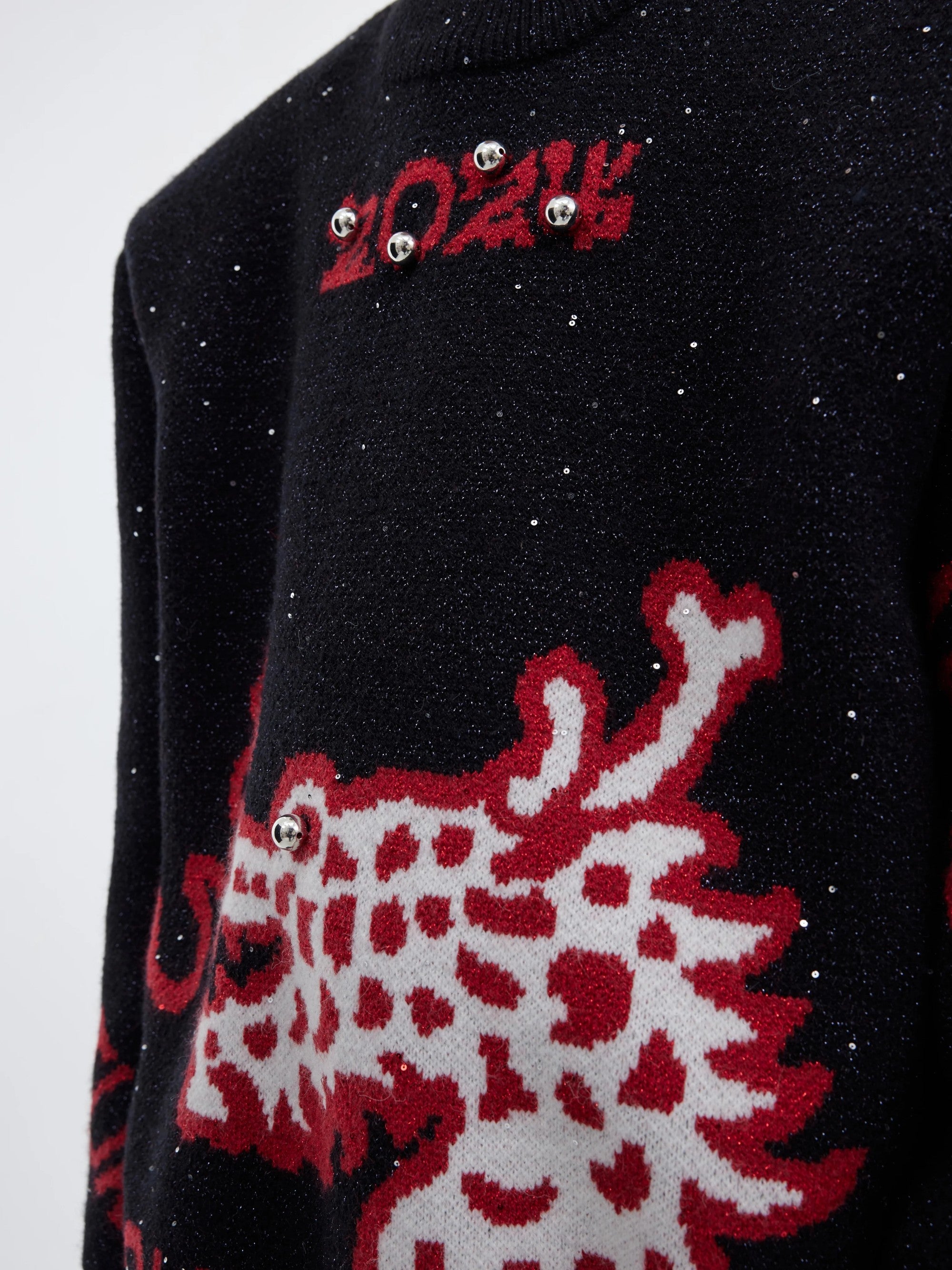 Back view showing the loose deconstructed fit of the streetwear sweater