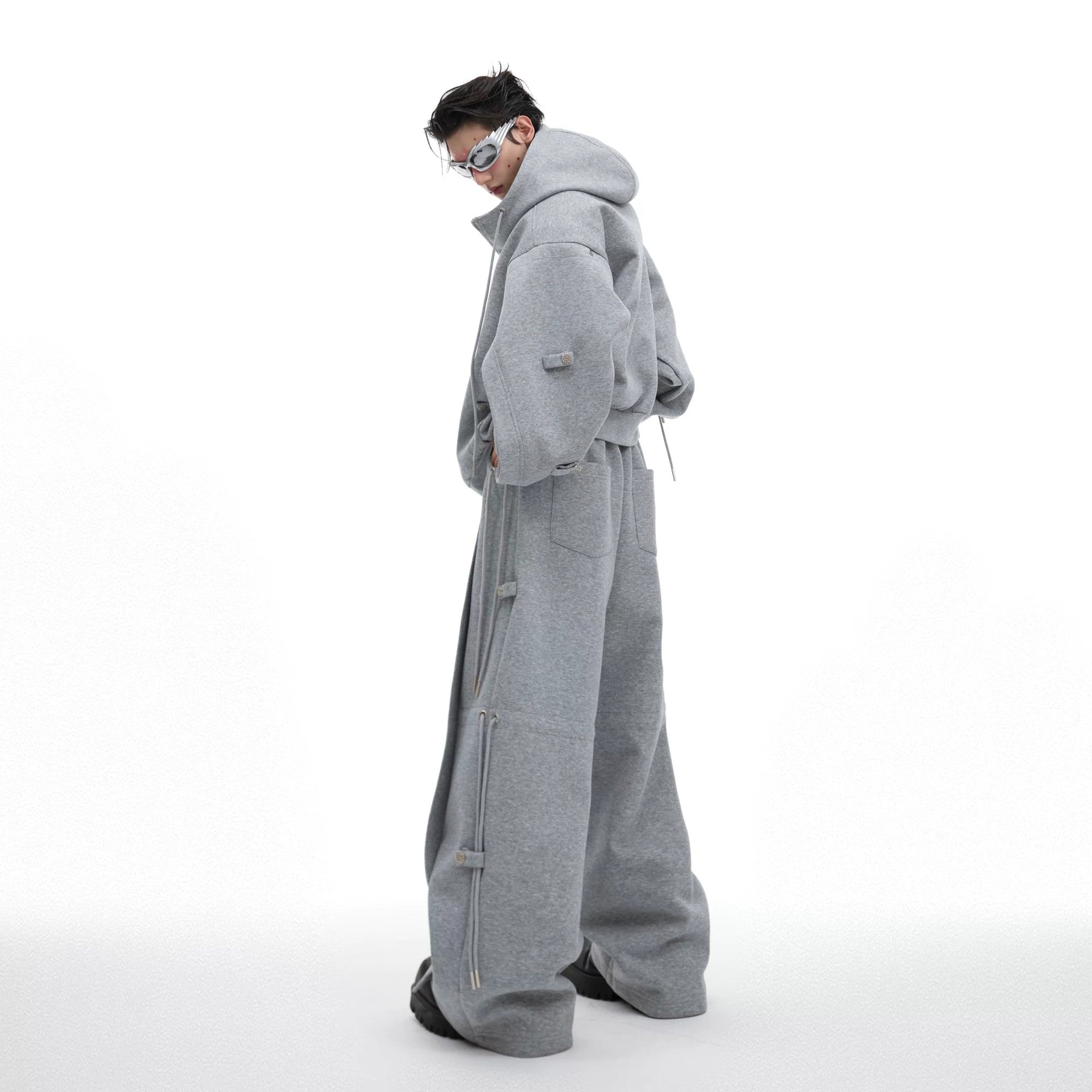 Detailed view of the wide-leg silhouette and heavy fabric drape