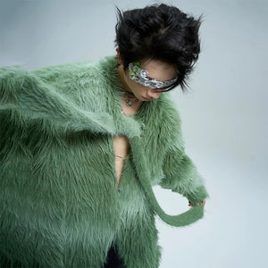 Close-up of blue faux mink knit texture and gradient stripes