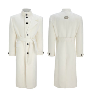 Side profile of oversized white wool coat showing deconstructed design
