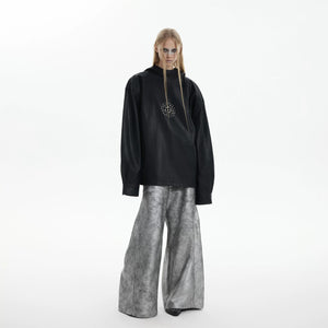 Back view of a boxy fit black leather hooded sweatshirt