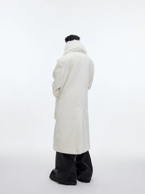 Close up of the detachable scarf and leather branding on wool coat