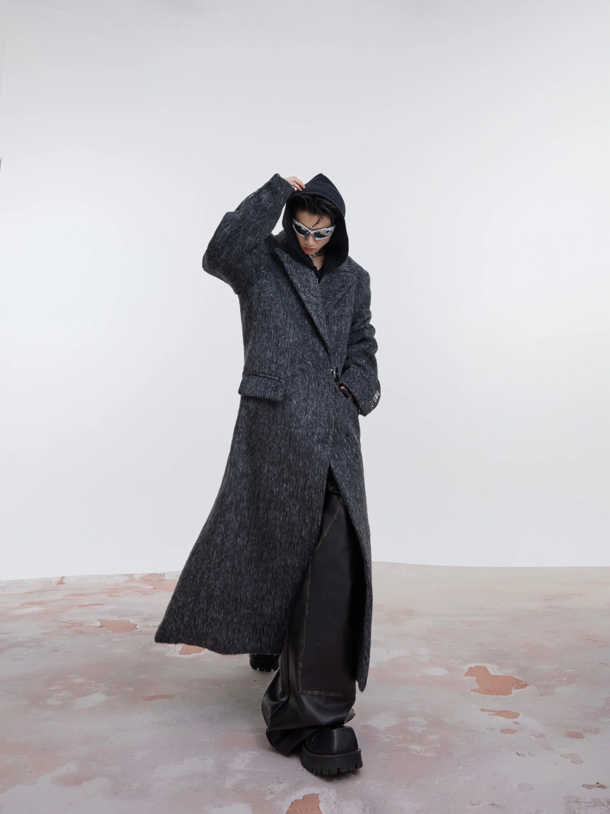Side view of a light gray long-line wool trench coat