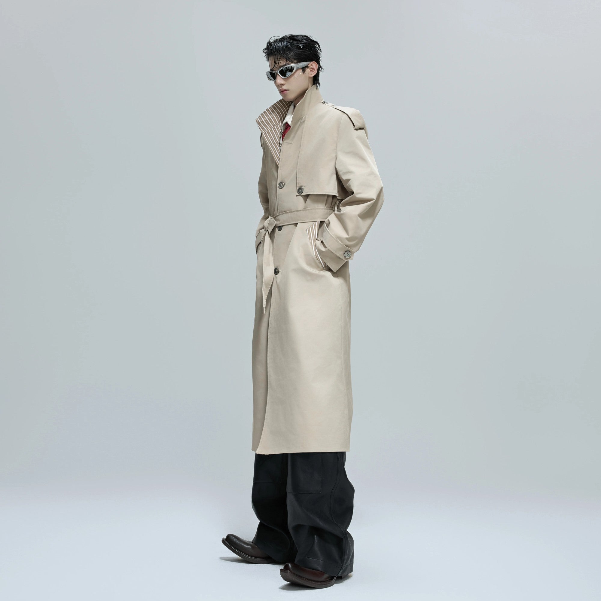 Back view of the oversized silhouette of a long autumn streetwear coat