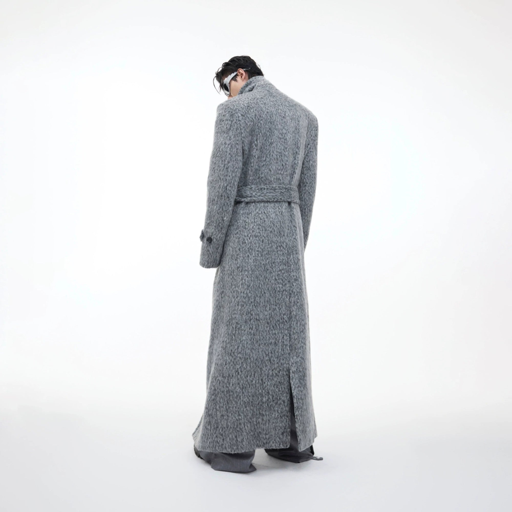 Model styling gray woolen trench coat with wide-leg pants