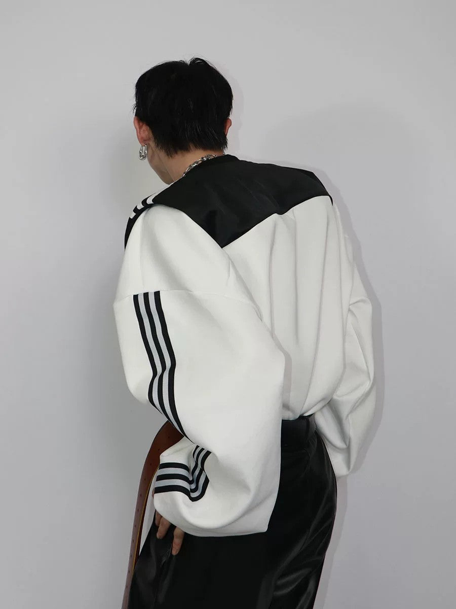 Close-up of the high-end patchwork vest design and padded shoulder detail