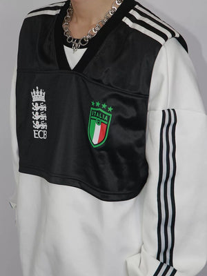 Lifestyle shot of a model wearing the loose fit fake two-piece sweatshirt