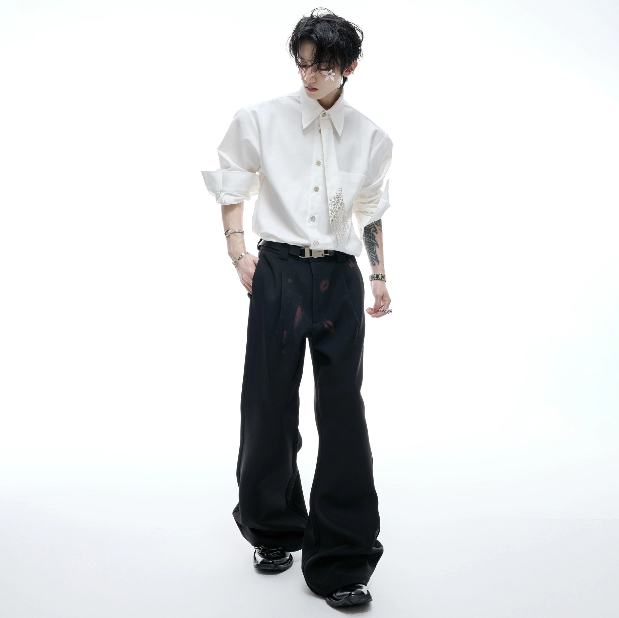 Unisex model wearing the padded shoulder tie shirt with baggy jeans