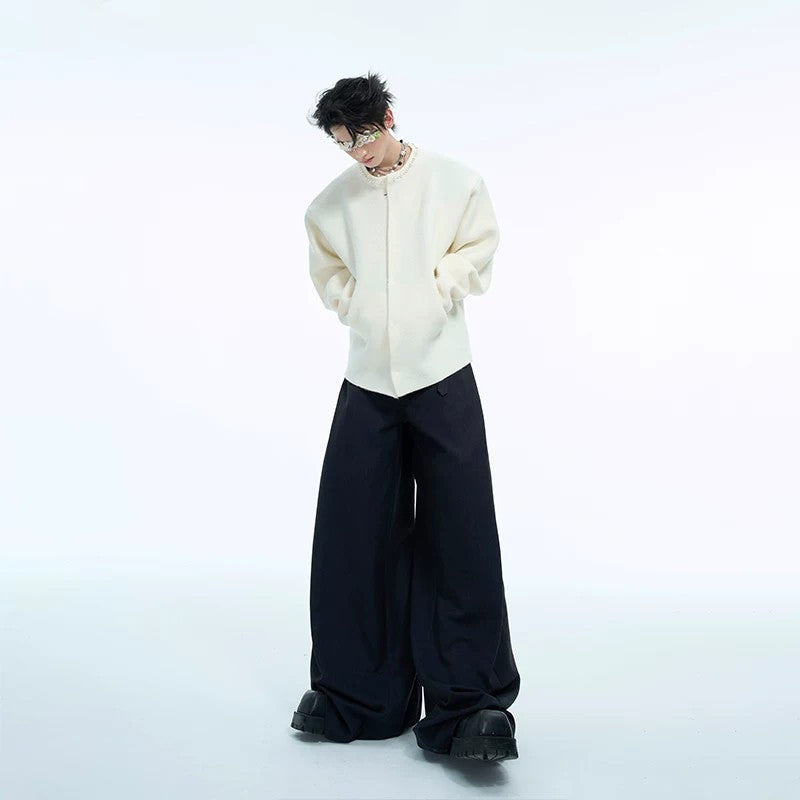 Display of pearl cardigans in white, gray, red, and black