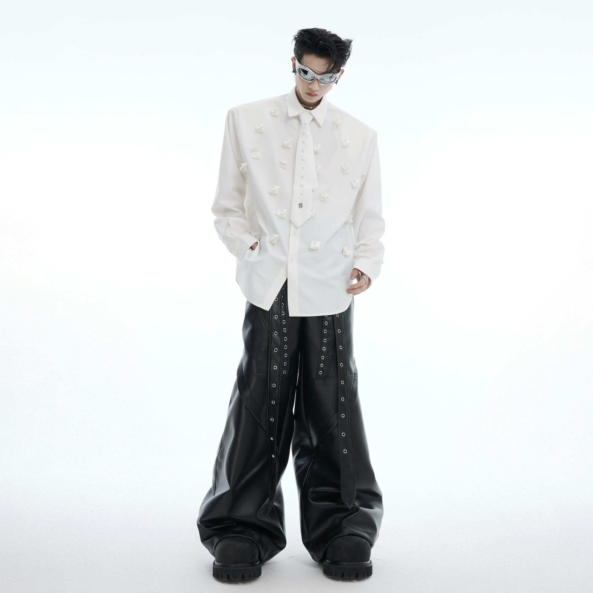 Close-up of pearl embellishments and integrated tie design