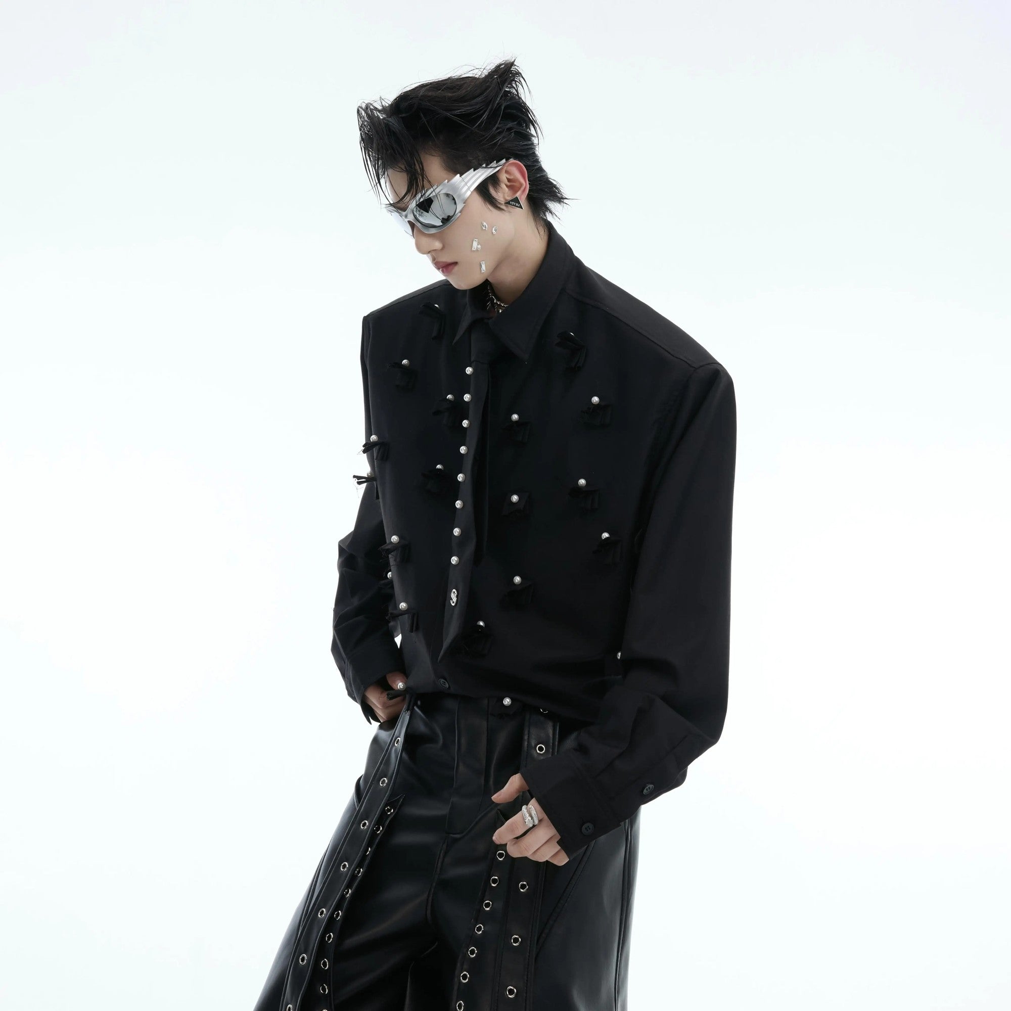 Internal view of detachable shoulder pads on black shirt