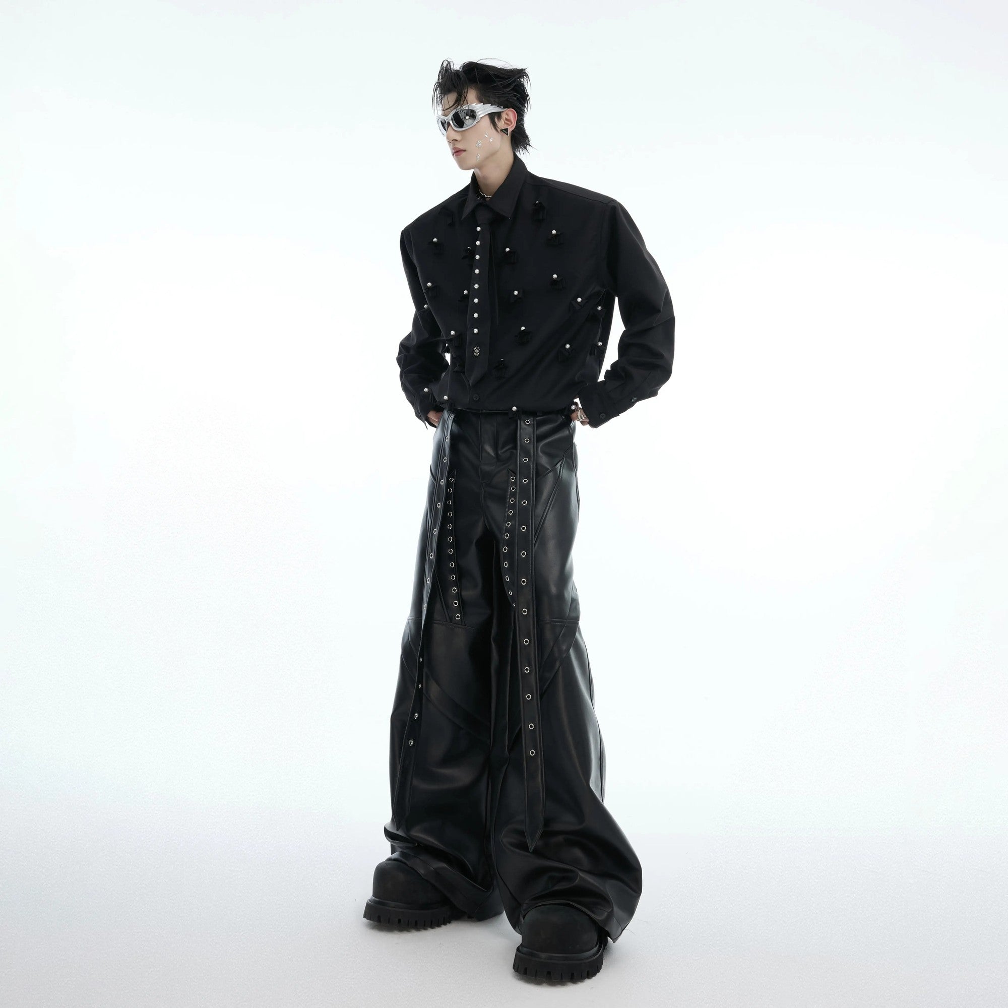 Model wearing black pearl tie shirt in urban street setting